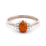 A fine orange sapphire and diamond ring