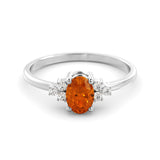 A fine orange sapphire and diamond ring