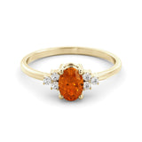 A fine orange sapphire and diamond ring