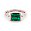 1.45 carat emerald ring and ten diamonds