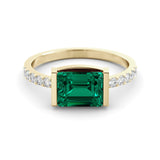 1.45 carat emerald ring and ten diamonds